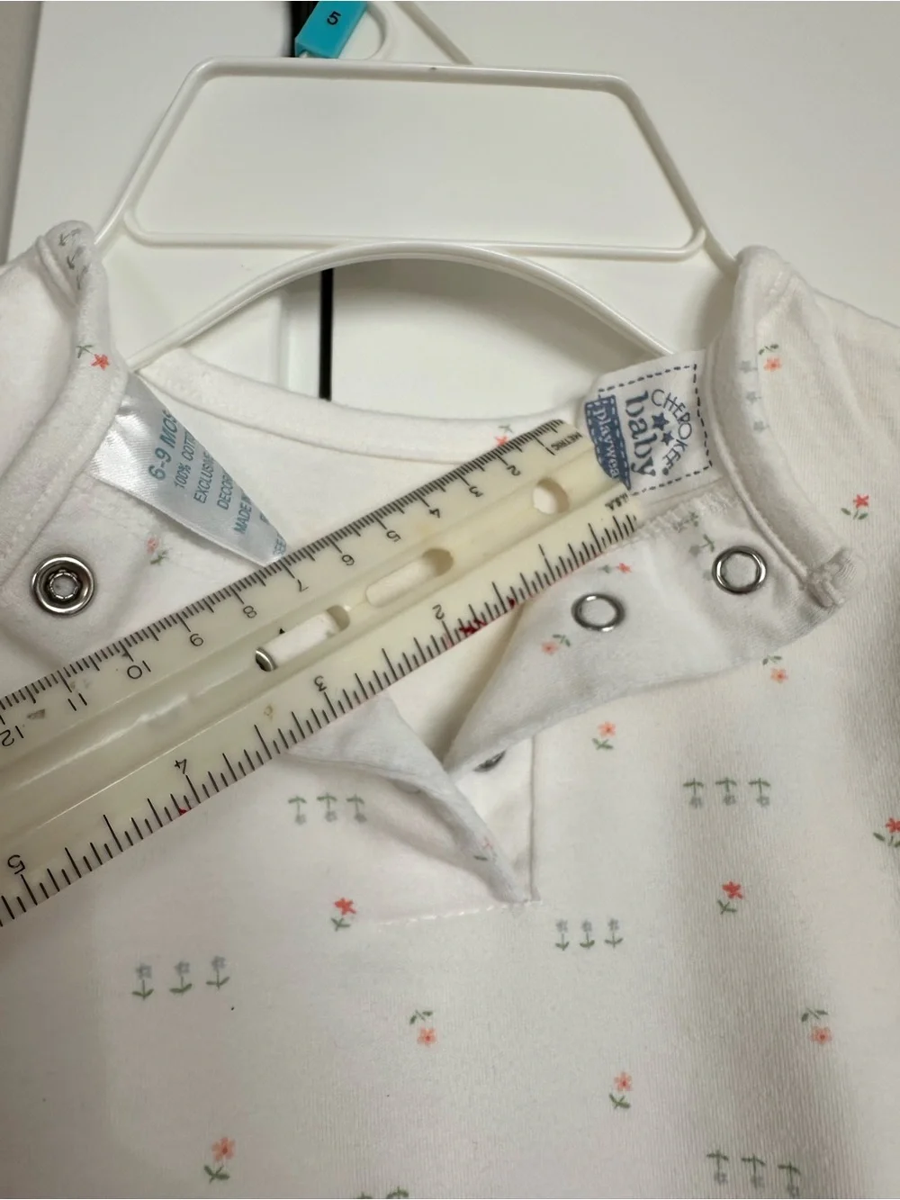 Cherokee baby play-wear. White Baby Onesie with Tiny Pink & Green Floral Print